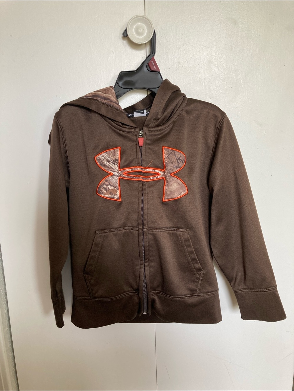 Under Armour Brown Hoodie with Camo Logo and Orange Trim
Boys size 4